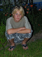 Naked blonde teen boy posing in the garden